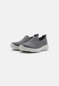 Slip-on shoes featuring a breathable grey mesh upper, padded collar, elastic goring, and a flexible white rubber sole.