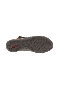 Semelle de chaussure présentant un motif de relief géométrique, principalement gris avec une finition texturée. Le logo de la marque est visible en rouge près du centre.