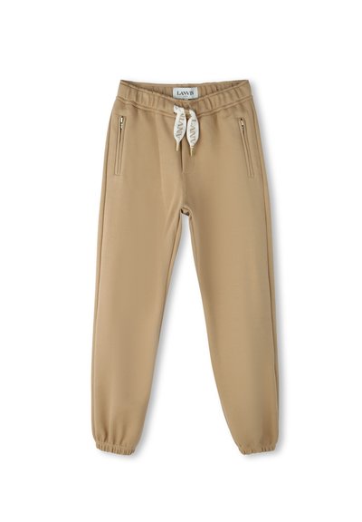 Beige joggings met een elastische tailleband, trektouw en twee ritszakken aan de zijkant. Gemaakt van een soepele, stretchy stof.