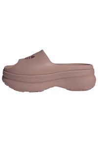 Mauve Slip-On-Clogs aus strukturiertem Kunststoff, mit abgerundeter Zehenpartie, erhöhtem Mittelfußbereich und Belüftungsschlitzen im vorderen Bereich.