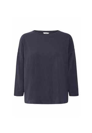 Chemise à manches longues bleu marine en tissu doux, avec une coupe décontractée et un col rond aux épaules abaissées. Sans motifs ni accents.