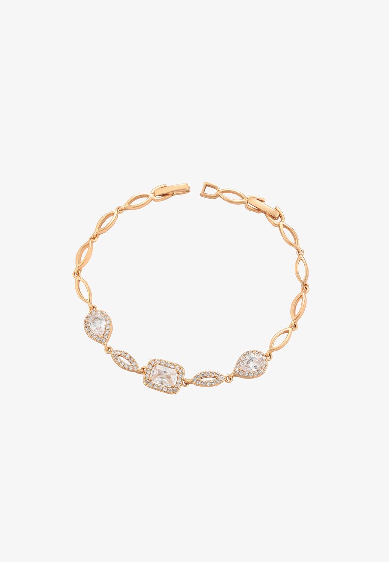 Aukso tono apyrankė su tarpusavyje susietais ovaliais žiedais, papuošta skaidriais stačiakampiais ir kriaušės formos brangakmeniais, taip pat turinti saugų užsegimą.