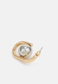 Gold-tone hoop earring with a silver reflective ball at the center and a straight post. Sleek, curved design with smooth texture.
