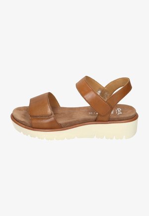 Brown leather sandal with two wide straps, soft suede insole, and a white platform sole. Features a rounded toe and textured exterior.