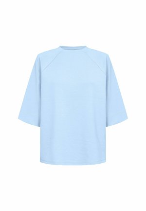 Light blue oversized t-shirt, short raglan sleeves, round neckline, made from soft cotton blend fabric, smooth texture, minimal design.