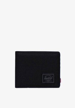 Zwarte stoffen portemonnee met een gestructureerd oppervlak, voorzien van een merkpatch en een rood-wit gestreepte accent aan de zijkant. Compacte rechthoekige vorm.