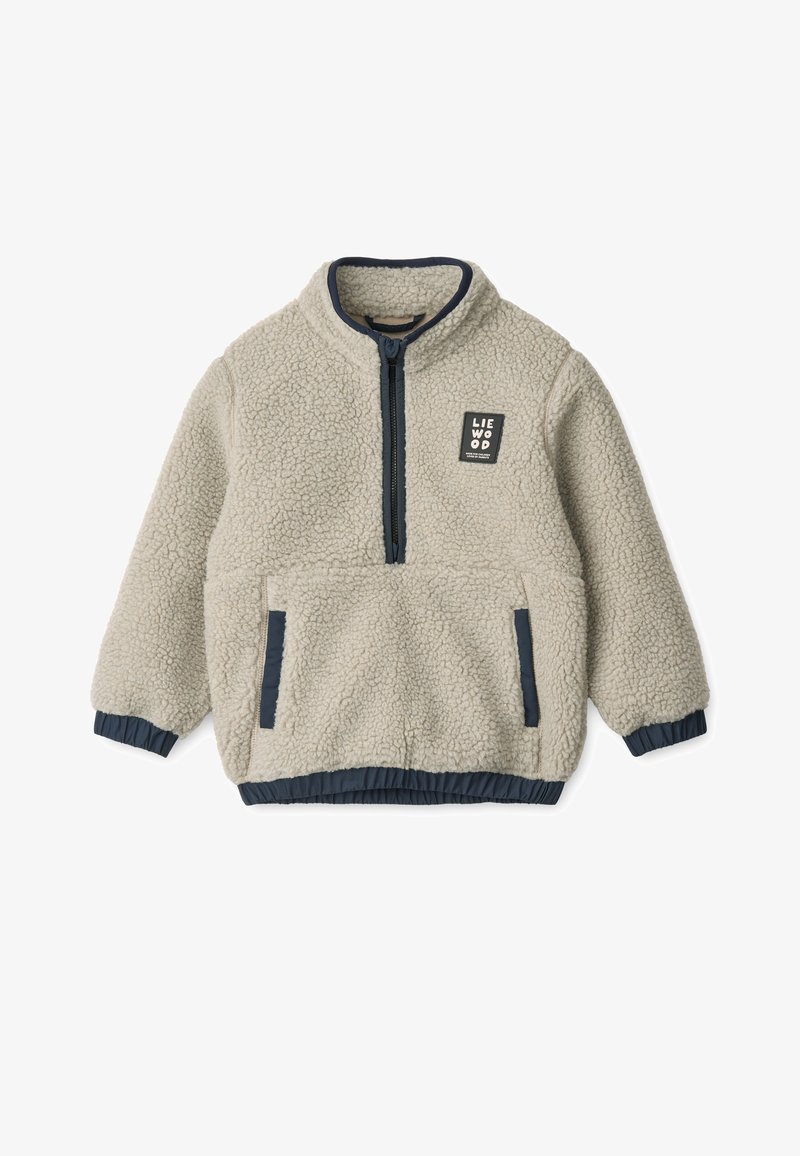 Svetlo béžová fleecová bunda so zipsom vpredu, námornícke akcenty a elastické manžety. Obsahuje štvorcový nášivku loga na hrudi.