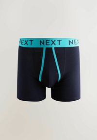 Boxer-culottes bleu marine avec une ceinture bleu clair arborant le logo "NEXT" répété. Tissu lisse et extensible avec un design classique.