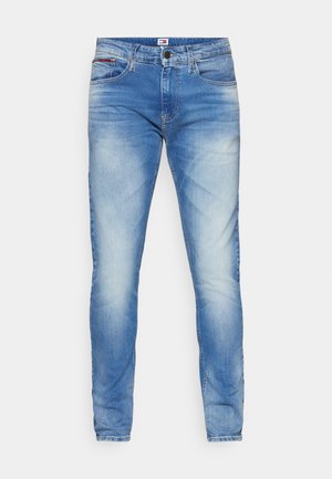 Light blue denim jeans with a slim fit, featuring fading and whiskering details. Includes a classic button and zipper closure, five pockets.