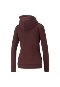Felpa bordeaux con silhouette aderente, polsini a coste e tasca a marsupio. Tessuto morbido e cappuccio foderato per il calore.