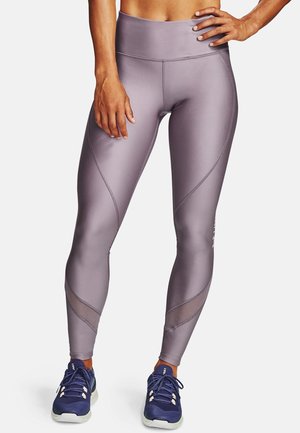 Leggings a vita alta in un lilla chiaro, realizzati in un materiale liscio e elasticizzato. Presentano pannelli in rete e dettagli delle cuciture curve.