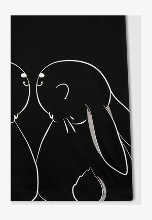 Tessuto nero con un design di due conigli contornati in bianco, con un coniglio accentuato da un dettaglio in glitter argento sull'orecchio.