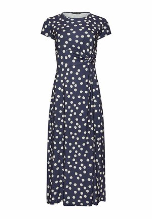 Robe maxi bleu marine à manches courtes avec des pois blancs et un détail nœud sur le côté à la taille.
