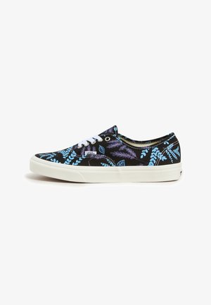Black canvas sneakers with a floral pattern in light blue and purple. White laces and rubber outsole. Low-top design.