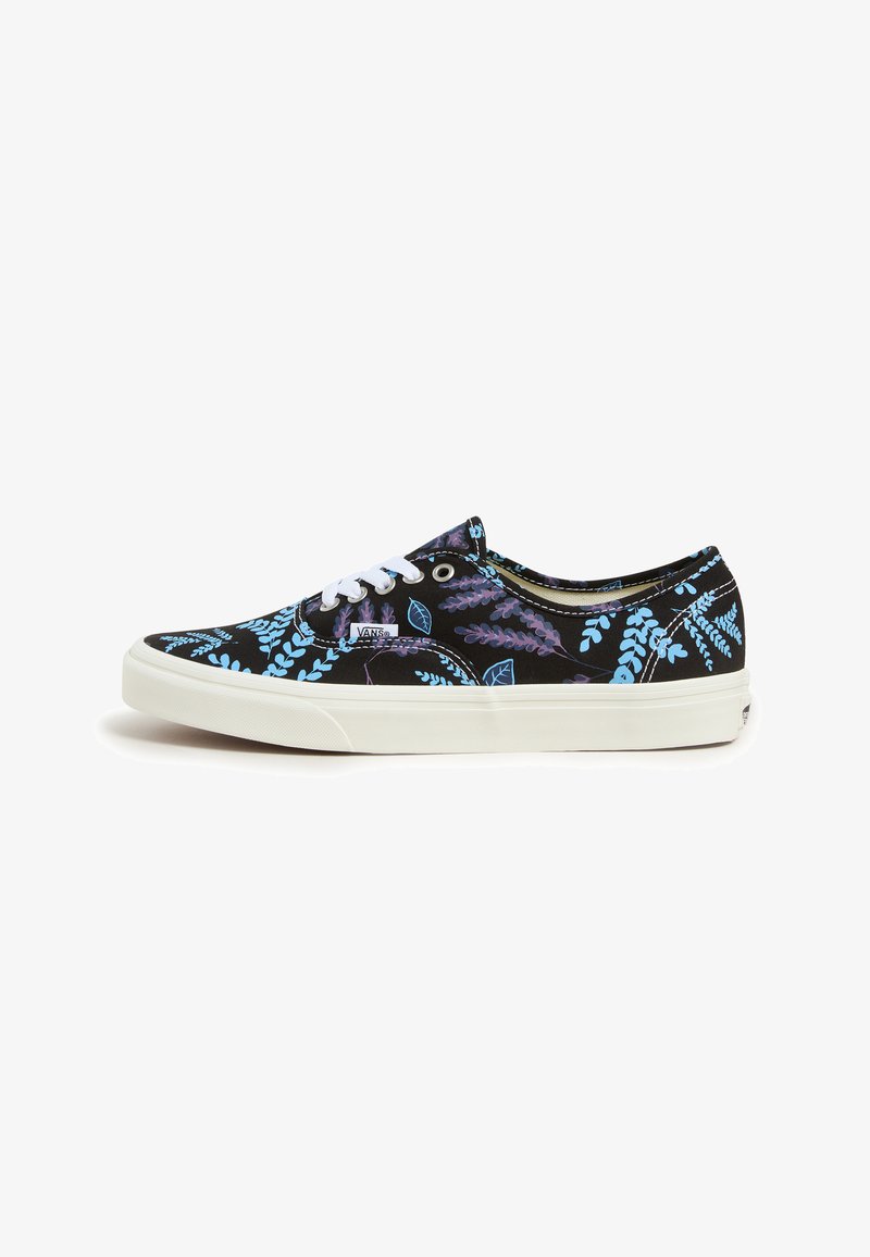 Black canvas sneakers with a floral pattern in light blue and purple. White laces and rubber outsole. Low-top design.