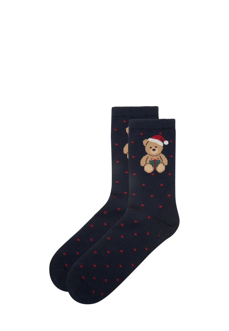 Marineblå sokker med en teddybjørn, der har en rød og hvid hat og små røde prikker. Lavet af blødt materiale, velegnet til afslappet brug.