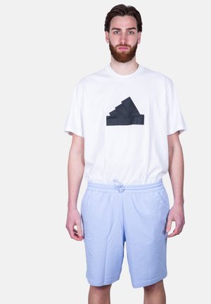 LOGO TONO SU - Pantalones deportivos - azzurro