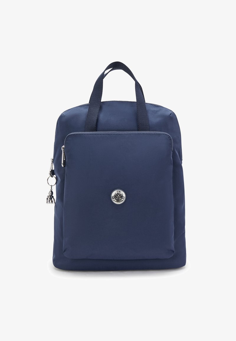 Navy blue backpack made of smooth fabric, featuring a front zip pocket, dual top handles, and a round emblem with a silver charm.