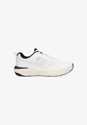 White athletic sneaker with black accents, thick cushioned sole, mesh panels, lace-up design, and "Toe Defender" feature on the toe area.