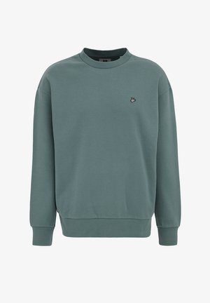 Pehmeast, hämarast rohelisest kangast pullover-särk. Omadused: ümar kaelus, soonikkoes mansetid ja alumine äär ning väike tikitud detail rinnal.