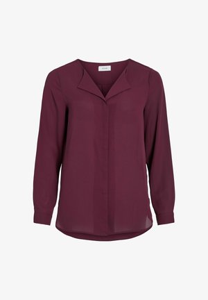 Vinsfarvet bluse med lange ærmer, V-udskæring og blødt, glat stof. Har en knappet front og let buet kant for komfort.