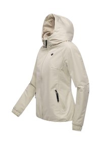 Jasnobeżowa kurtka zapinana na zamek błyskawiczny z kapturem, z elastycznymi mankietami, dwoma bocznymi kieszeniami na zamek i subtelną fakturą. Brak widocznych logo lub wzorów.
