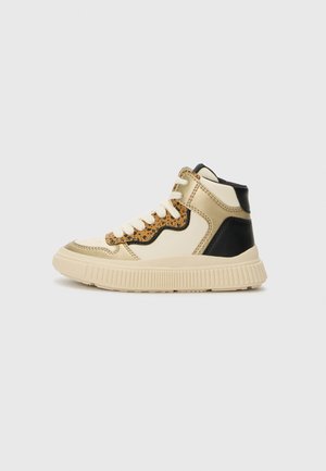 High-top sneaker featuring a beige faux leather upper, black accents, and a leopard print design on the side. Thick rubber sole and laces.