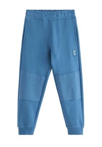 Niebieskie spodnie dresowe wykonane z miękkiego materiału, z fakturowanymi panelami na kolanach, bocznymi kieszeniami oraz elastycznym pasem.