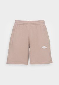 Beiga träningsshorts gjorda av mjukt tyg, med resårmidja, sidofickor och en liten, ton-i-ton logopatch.