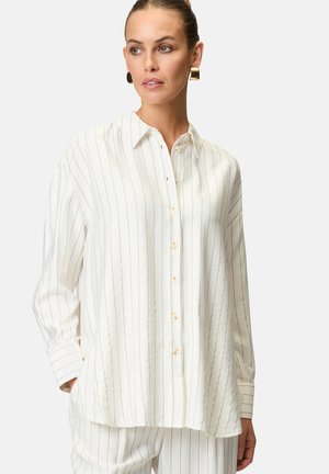 White button-up shirt in lightweight fabric, featuring vertical blue stripes, a pointed collar, and long sleeves with cuff details.