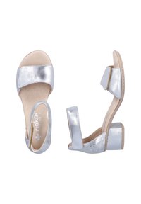 Silver metallic sandals with a wide toe strap, a soft footbed, and a short block heel. Adjustable ankle strap for fit and support.