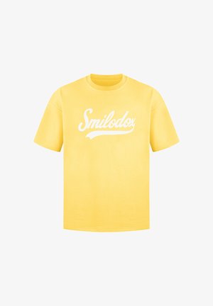 T-shirt di cotone giallo con maniche corte, con logo in bianco "Smilodox" sulla parte anteriore. Collo a giro classico.