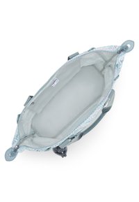 Light grey bag with a floral patterned exterior, zip closure, and two fabric handles. Interior is spacious, lined, and unembellished.