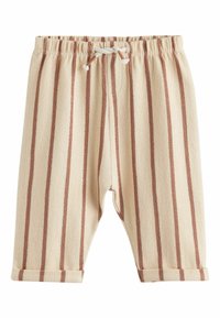 Světlé béžové dětské kalhoty s vertikálními pruhy v rezavé barvě, elastickým pasem a ohrnutými lemy. Strukturální látka dodává hloubku.