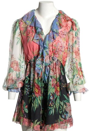Robe courte multicolore à fleurs avec manches ballons transparentes, col volanté et taille cintrée, présentée sur un mannequin blanc.