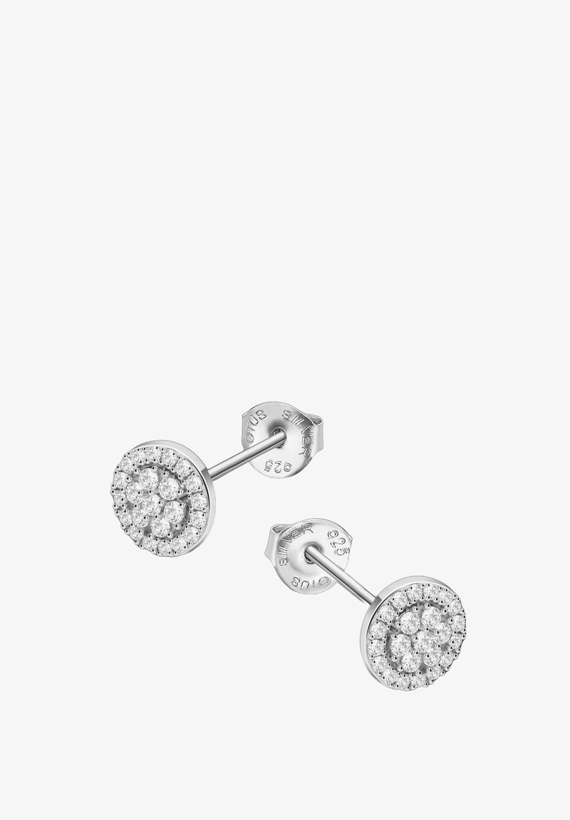 Boucles d'oreilles en argent à clou présentant un design circulaire orné de pierres étincelantes, créant un motif floral. Poinçonnées 925 pour garantir la qualité de l'argent.