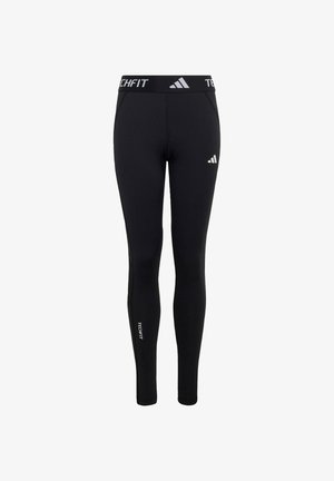 Leggings noirs Adidas Techfit moulants avec logo sur la cuisse gauche, inscription "TECHFIT" sur la ceinture et sur le bas de la jambe droite, coupe slim.