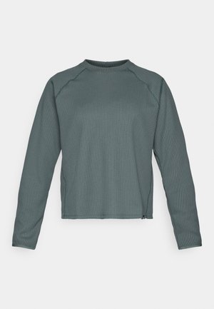 Long-sleeved, crew-neck top in textured dark teal fabric, featuring ribbed pattern and slightly cropped hem.