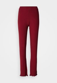Pantalon rouge en maille côtelée avec jambe droite et ourlet à volants, présenté de face sur un fond clair uni.