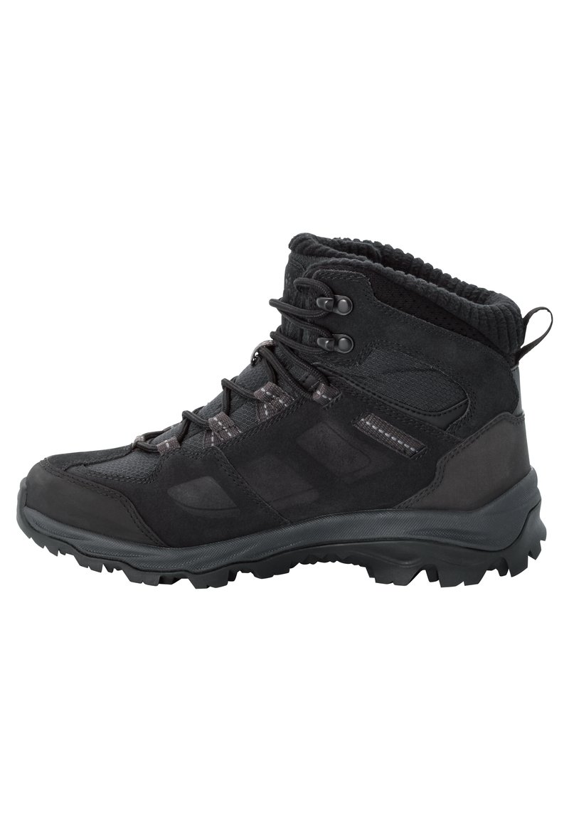 Bottines de randonnée noires en mélange de daim et de mesh, avec un bon maintien de la cheville, une semelle en caoutchouc texturée et des œillets renforcés pour les lacets.