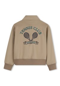 Μπεζ μπουφάν τένις συλλόγου με ριμπ τελείωμα, με κέντημα "TENNIS CLUB" και γραφικό με δύο διασταυρωμένες ρακέτες στην πλάτη.