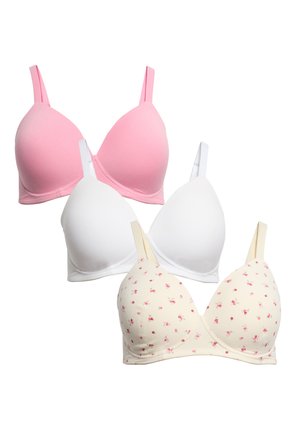 Tre reggiseni da donna in rosa, bianco e crema con piccoli motivi floreali rosa, mostrati su uno sfondo bianco.