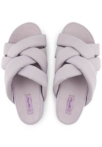 Lavender slide sandals with a braided strap design. Soft material and flat sole with a textured footbed. Label visible on the insole.