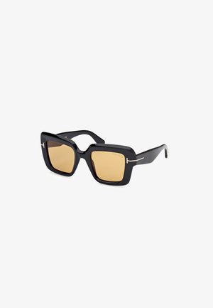 Black oversized sunglasses with square frames, brown tinted lenses, minimal metallic accents, and slightly thicker temples.