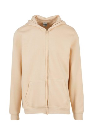 Rozā krāsas zip-up kapuce izgatavota no mīksta auduma, ar kangaroo kabatu un regulējamu auklu kapuci.