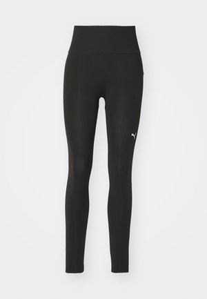 Leggings negre din material elastic, cu un talie înaltă, design fără cusături și un mic logo alb pe coapsa stângă.