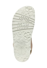 Semelle de chaussure blanche en caoutchouc avec des motifs en relief d'étoiles et de fleurs, dotée de trous de ventilation et du texte "FLEXY SYSTEM". Taille 31 indiquée.