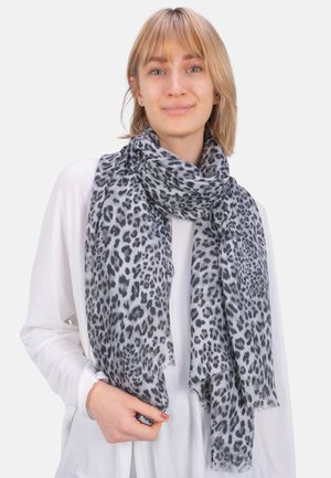 Grey scarf featuring a leopard print pattern, made from a soft material with fringed edges. Drape style around the neck.