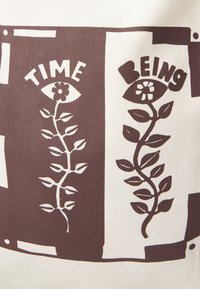 Canvas bag with brown print. Features the words "TIME" and "BEING" with stylized leaves and flowers against a light background.