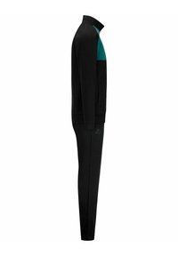 Completo sportivo nero con giacca con zip e accenti turchesi sulle spalle e pantaloni neri affusolati, entrambi realizzati in tessuto liscio e dotati di tasche laterali.